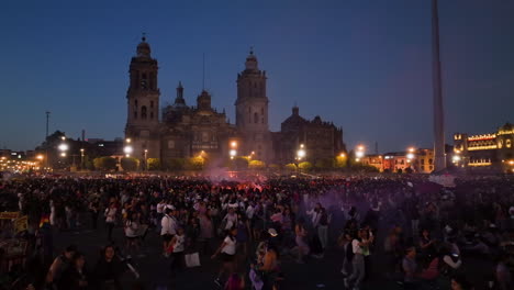 Aerial-view-of-a-feminist-riot-on-the-Zocolo-square,-International-women´s-day-night-in-Mexico-city
