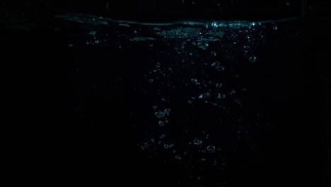 Underwater-shot-of-wrist-watch-drowning-in-slow-motion