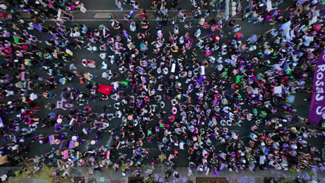 Aerial-view-above-people-marching-on-International-Women's-Day-in-Mexico-city---top-down,-drone-shot