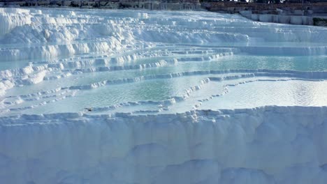 White-travertine-terraces-or-travertine-pools-that-cascade-down-the-hillside-in-Pamukkale