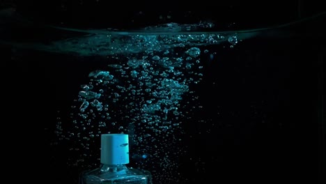 Bottle-of-perfume-drowning-in-water
