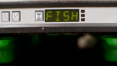 Close-up-of-fish-heat-container-being-pulled-out-in-fast-food-kitchen