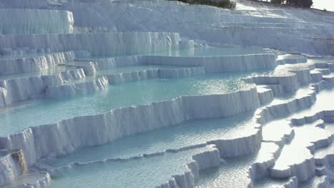 White-travertine-terraces-or-travertine-pools-that-cascade-down-the-hillside-in-Pamukkale