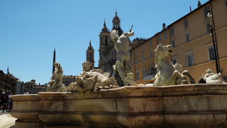 Fountain-of-the-Neptune-in-Piazza-Navona,-in-a-hot-summer-day,-Rome,-Italy