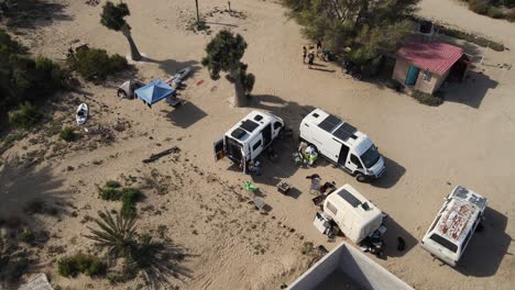 Aerial-orbit-of-overlanding-campers-and-adventurous-housing-in-Bahia-Asuncion-Mexico