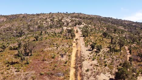 Aerial-View-Moving-Towards-Outback-Hillside-With-Hiking-Trail,-Perth-Australia