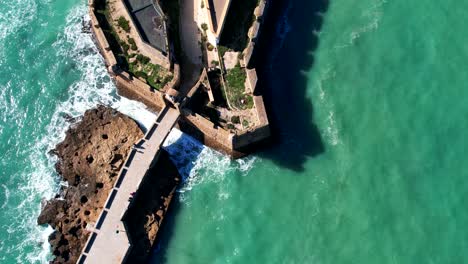 Top-down-aerial-view-of-the-castle-of-San-Sebastian-in-Cadiz,-Spain