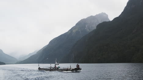 Large-flat-bottomed-barge-on-shallow-draft-waterways,-Doubtful-Sound,-Patea-New-Zealand