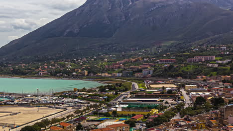 Seaside-town-on-Termini-Imerece,-Sicily-Italy-in-a-valley-beneath-the-mountains---time-lapse