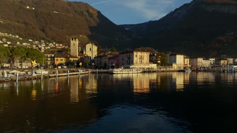 Mirror-Reflections-Of-Pisogne-Town-In-Lake-Iseo,-Lombardy,-Italy