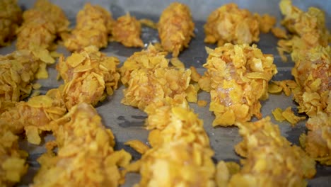 Raw-Chicken-in-Cornflakes-Coating-in-a-Baking-Tray