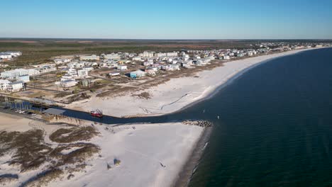 panning-drone-view-from-over-water-of-Mexico-beach-Florida-showing-white-sands-and-rebuilding-four-years-after-hurricane-Michael