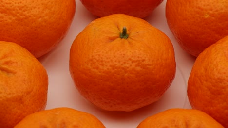Fresh-mandarin-from-Calabria,-South-Italy,-on-display-rotating