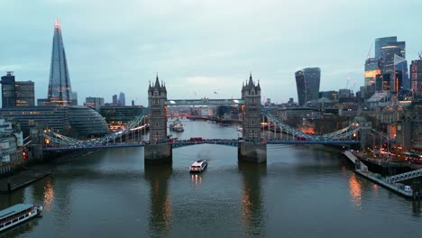 Truck-left-drone-shot-of-the-Tower-Bridge-in-London,-England,-in-the-evening