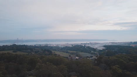 Drone-view-at-Parque-Florestal-de-Monsanto-with-view-at-Lisbon-and-Rio-Tejo