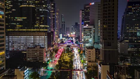Bangkok-city-center-at-night,-Rush-hour-traffic-with-stunning-skyline-and-fast-moving-traffic-along-busy-road,-The-city-that-never-sleeps