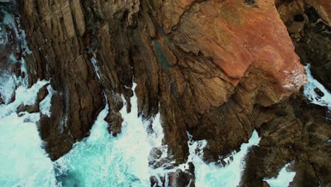 Drone-of-Light-Blue-Waves-Crash-at-Bermagui-Blue-Pool-Rocks,-Australia-2