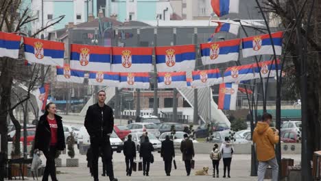 Streetview-northern-Mitrovica,-Kosovo-with-many-Serbian-flags