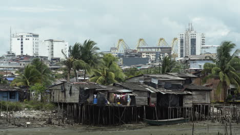 Wide-shot-of-stilt-houses-in-foreground-and-city-buildings-in-the-background-of-Buenaventura
