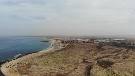 Aerial-View-Of-Empty-Coastline-With-View-Of-Bikini-Beach-In-Background-At-Sal-Cape-Verde