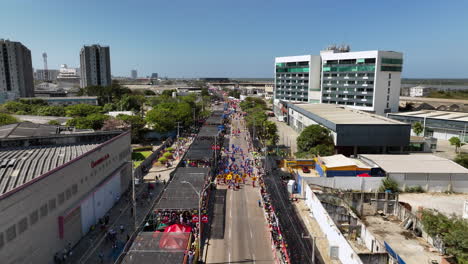 Aerial-view-over-the-Batalla-de-Flores-Parade-in-sunny-Barranquilla,-Colombia