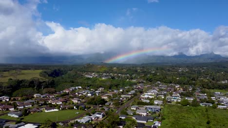 Cinematic-arial-view-of-rainbow-in-cloudy-sky-in-Kauai,-Hawaii