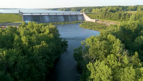 Aerial-flyover-creek-toward-reservoir-dam,-Hoover-Reservoir-Dam,-Westerville,-Ohio