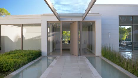 Stunning-Glass-Porch-Entrance-of-a-Luxury-House-in-Cannes-with-Impressive-Door-Opening