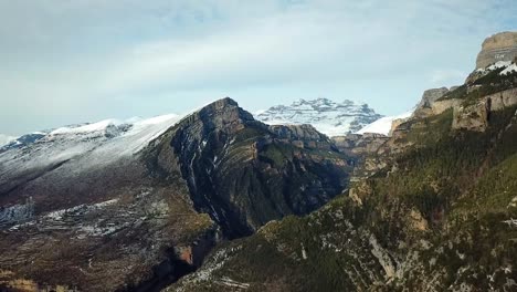 Drone-footage-of-a-canyon-on-snowy-mountain