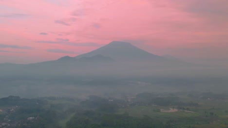 Hyperlapse-aerial-footage-of-beautiful-rural-landscape-in-the-foggy-sunrise-time-with-red-sky