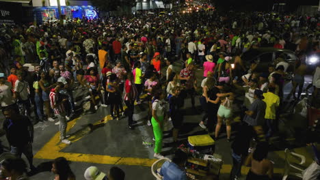 Aerial-view-of-people-celebrating-the-Carnival-of-Barranquilla,-night-in-Colombia
