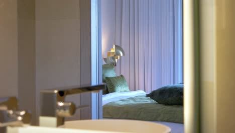 revealing-shot-of-an-ensuite-bathroom-and-mirror-reflecting-the-room-in-Mougins