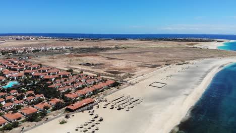Aerial-Over-Beach-Side-Villas-Next-To-Empty-Plot-Of-Land-In-Sal-Cape-Verde