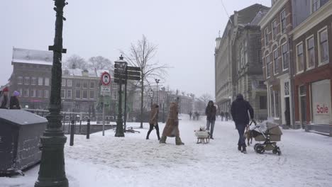 Leiden-town-covered-in-winter-snow,-Netherlands,-city-center,-fish-market