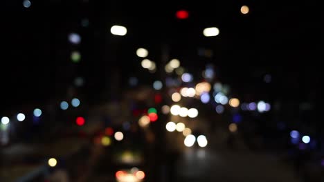 Timelapse-of-traffic-car's-bokeh-lights-on-urban-street-at-night-in-Dhaka-City,-Bangladesh