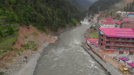 Aerial-Over-Swat-River-With-New-Honey-Moon-Hotel-In-View