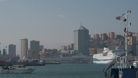 Genoa-skyline-and-boats-ships-passing-in-marine-sea-coast