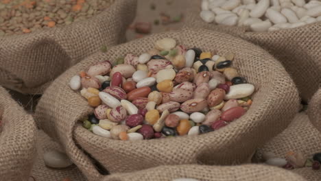 Dry-legumes-beans-falling-on-jute-bowl