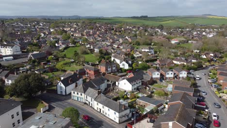 Aerial-drone-static-shot-over-rural-suburb-village-housing-estate-in-Exeter,-England
