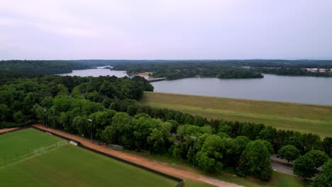 Clemson-Athletic-Fields-in-Foreground-and-Lake-Hartwell-in-Background-Aerial-Push