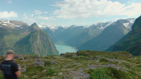 Overview-Of-Oldevatnet-From-Klovane-Peak-In-Olden,-Norway-With-Tourist-Hikers