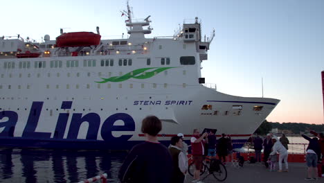 People-see-off-their-family-who-took-a-tour-on-Stena-spirit-cruise-ship-liner-from-Harbor-in-Gdynia,-panning-shot