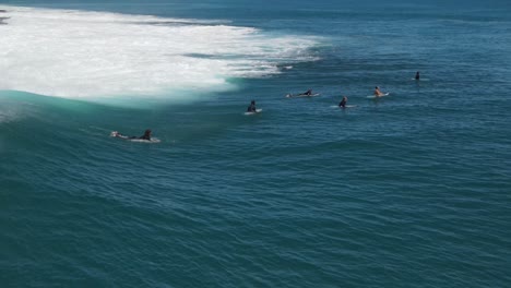 Aerial-footage-of-surfers-going-over-waves-at-Jake’s-point-Western-Australia