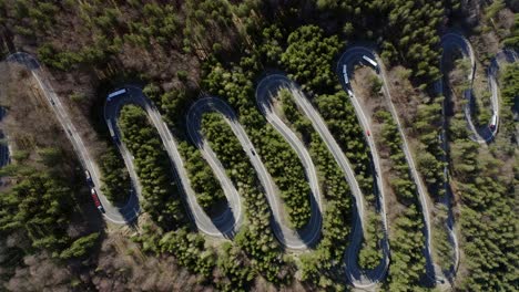 Bird's-Eye-View-Of-Curvy-Winding-Road-With-Trucks-And-Cars-Passing