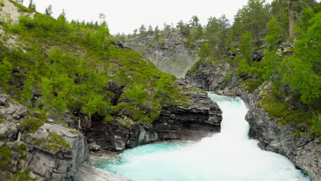 River-Rapids-Flowing-Fast-Between-Rocks-In-A-Mountain-Forest-In-Stryn,-Norway