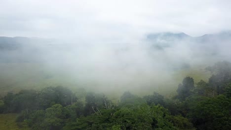 Aerial-shot-of-the-misty-sky-over-the-rainforest-of-Gabon,-Africa