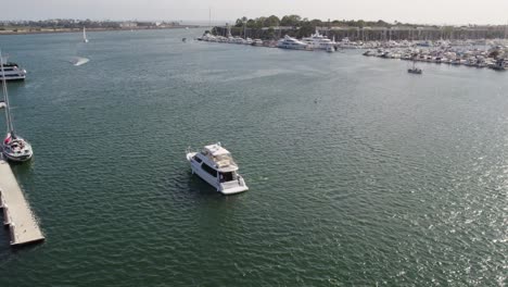 Drone-shot-of-yacht-pulling-into-harbor