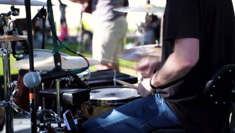 Concert-in-the-park---isolated-on-the-drummer's-sticks-and-drums-keeping-the-beat