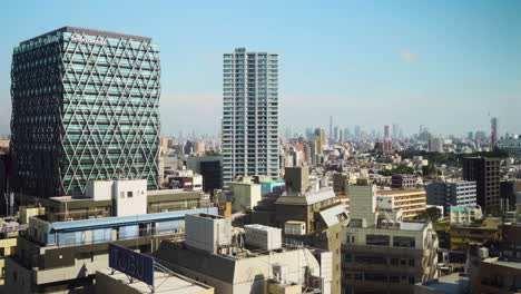 Panoramic-view-of-Tokyo-skyline-with-densely-packed-buildings-on-a-sunny-afternoon