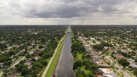 An-aerial-view-of-a-long-canal-on-a-cloudy-day